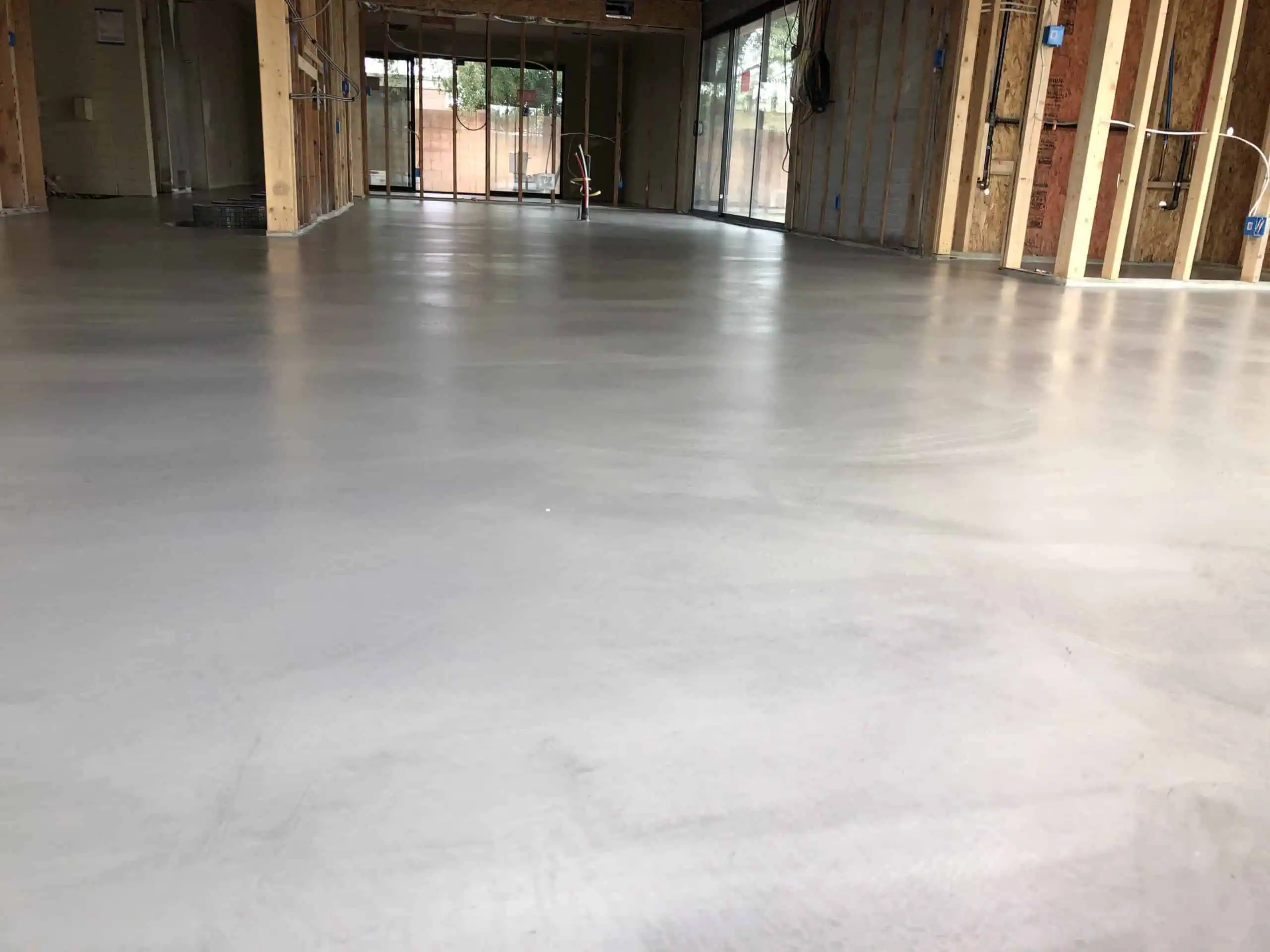Microtopping vs Polished Concrete: The 1/8” System That Fixes Bad Slabs in the Phoenix Valley