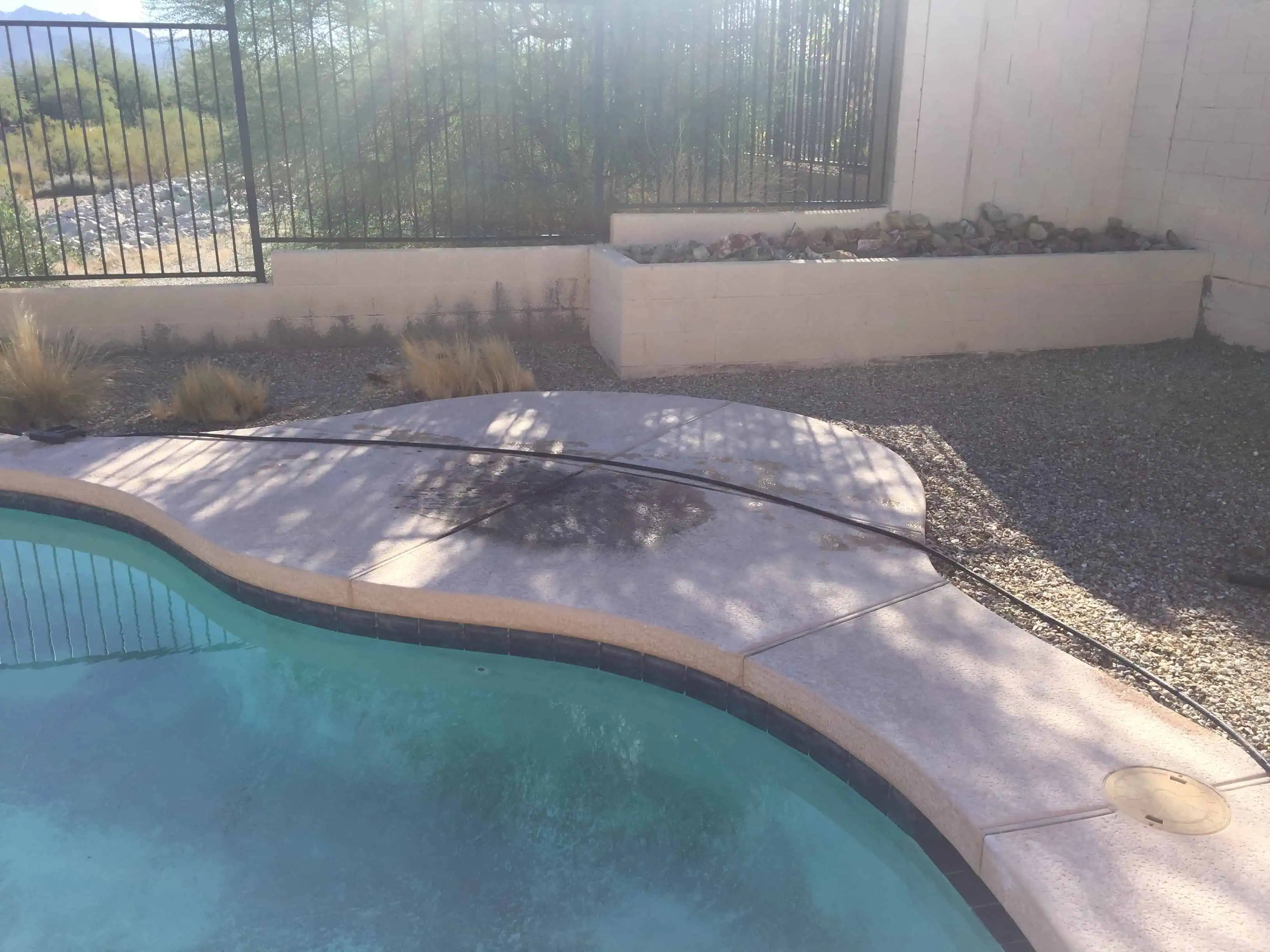Chipped and Calcified Swimming Pool Deck Area